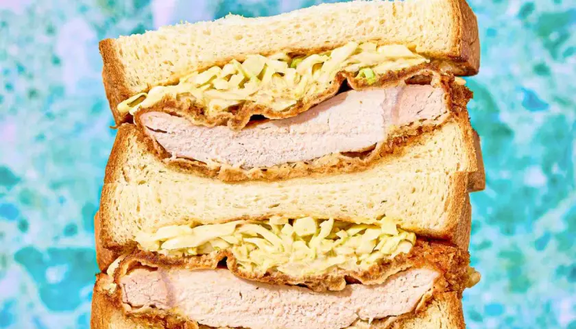A delicious sando stacked high with crispy fried chicken and creamy coleslaw.
