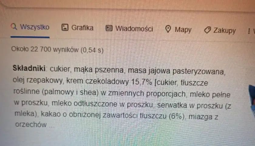 Wyniki wyszukiwania "wedel babeczka składniki" pokazują składniki muffina, ale nie podają, ile kalorii ma muffin Wedel.