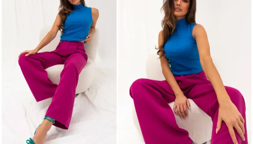 Modelka w stylizacji, która udowadnia, czy niebieski pasuje do różowego. Wyraziste kolory i luźne spodnie tworzą modny look.