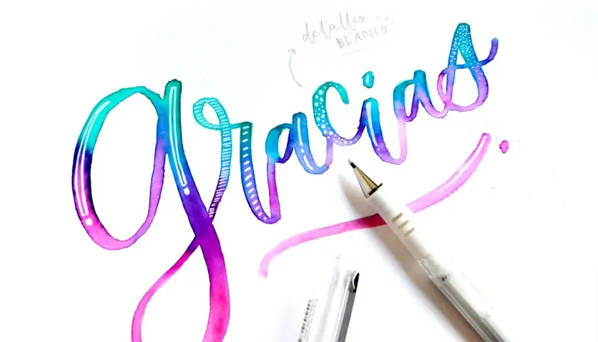 Hermosos ejemplos de lettering con la palabra "Gracias" en acuarela degradada, con detalles en blanco y un bolígrafo.