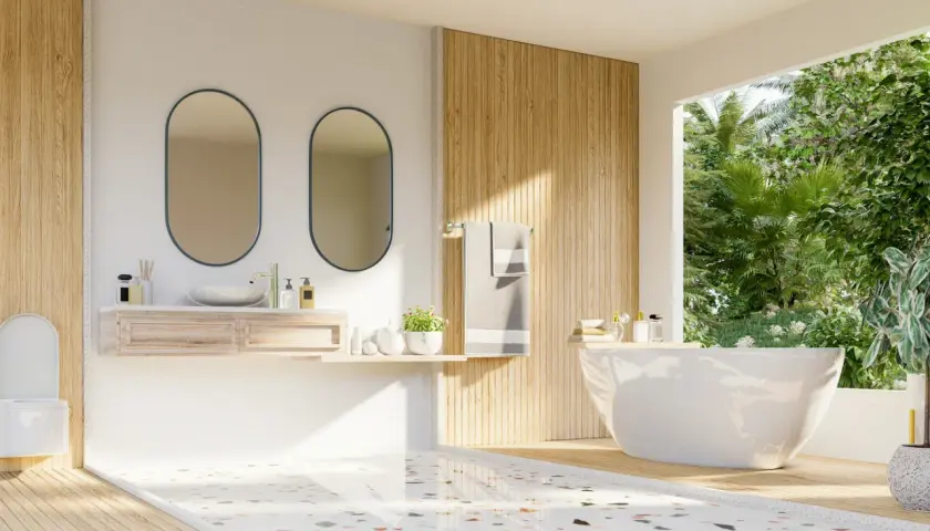 Modernt badrum med fristående badkar, dubbla speglar och trädetaljer. Golvet har en mönstrad design som visar skillnad på kakel och klinker.