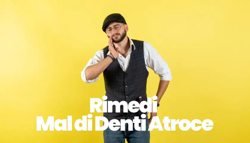 Uomo con cappello e occhiali si tiene la guancia, soffre di mal di denti atroce. Testo bianco su sfondo giallo: "Rimedi Mal di Denti Atroce".
