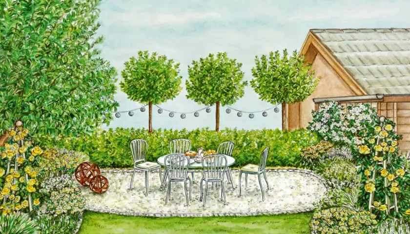 Eine gemütliche Sitzecke mit Tisch und Stühlen, umgeben von blühenden Rosen und Sträuchern. So lässt sich eine tote Ecke im Garten gestalten.