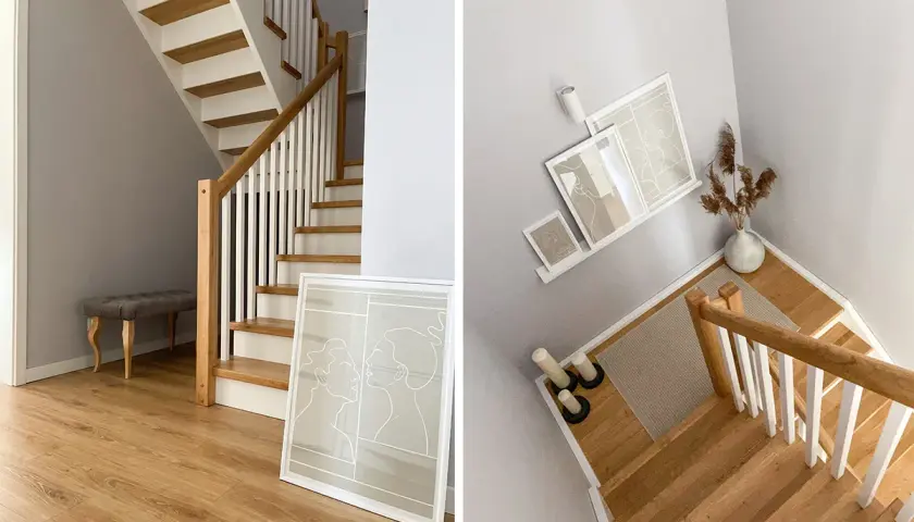 Nowoczesna klatka schodowa inspiracje: drewniane stopnie, białe balustrady, szara ściana, ławka i minimalistyczne grafiki tworzą przytulną przestrzeń.
