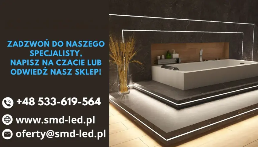 Nowoczesna łazienka z wanną i dyskretnym podświetleniem LED.