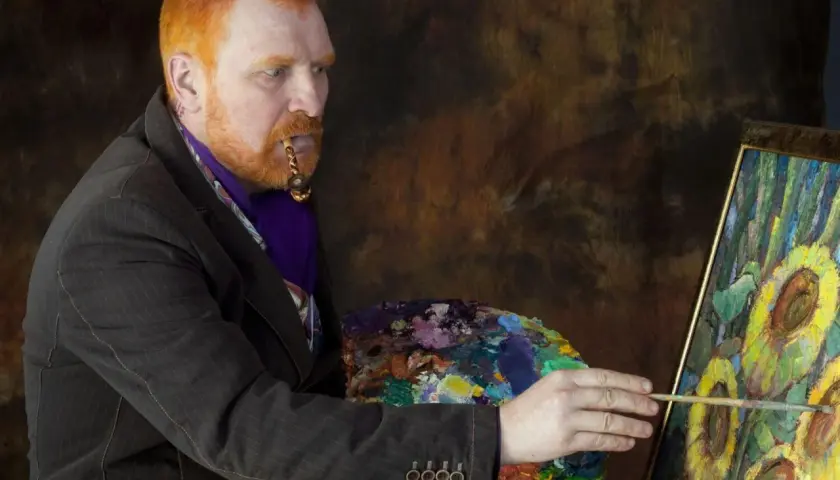 Mężczyzna z rudą brodą i fajką w ustach, malujący słoneczniki. Ciekawe van gogh ciekawostki o jego życiu i sztuce.