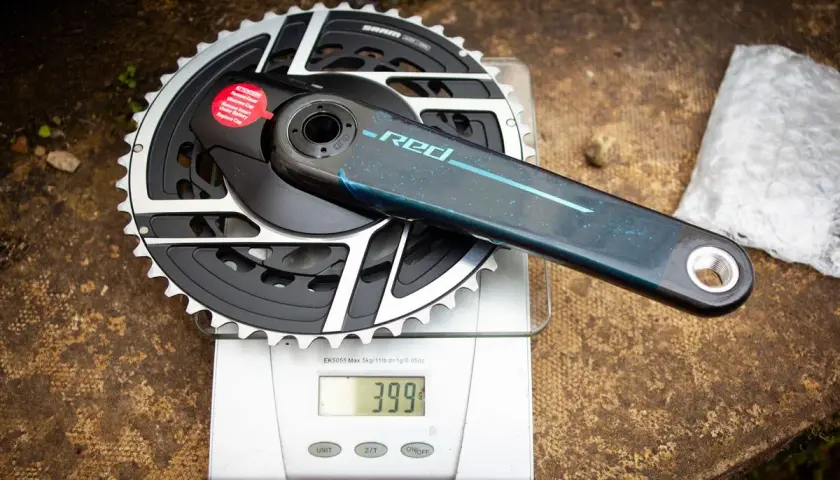 SRAM Red crankset weights 399g on a digital scale. This lightweight component is ready for performance cycling.