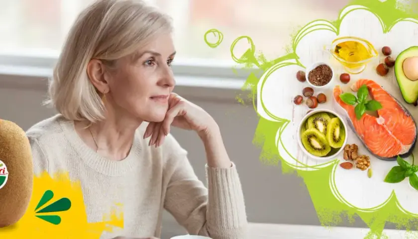 Äldre kvinna funderar över hälsosam mat med lax, avokado, nötter och kiwi. Fett som en del av en balanserad kost.