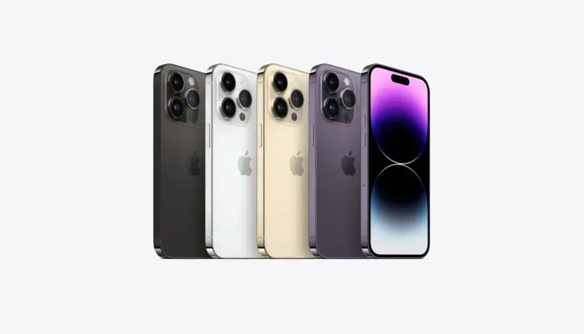Pięć iPhone'ów 14 Pro w różnych kolorach: czarnym, białym, złotym, fioletowym i z fioletowym ekranem.