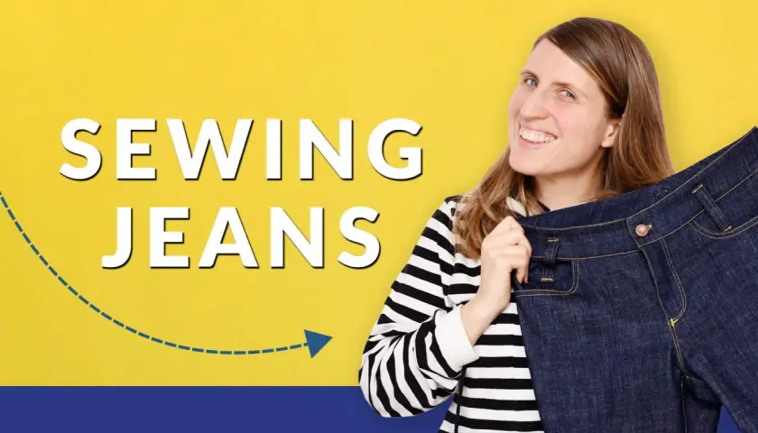 Woman smiles, holding up a pair of dark denim jeans, with "SEWING JEANS" text.