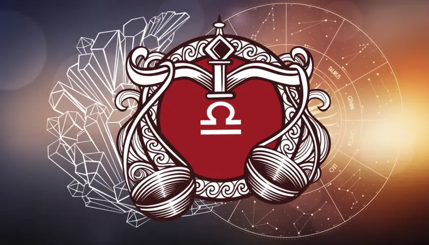 Symbol znaku zodiaku Waga, otoczony ozdobnymi elementami, kryształami i kołem zodiaku.