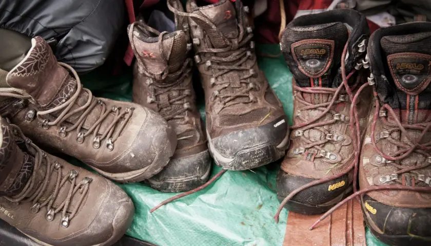 Muddy hiking boots, a testament to adventure. Learn how to care for waterproof leather boots to keep them ready for the next trail.