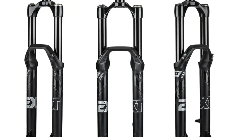 Three black EXT era bicycle forks are displayed.