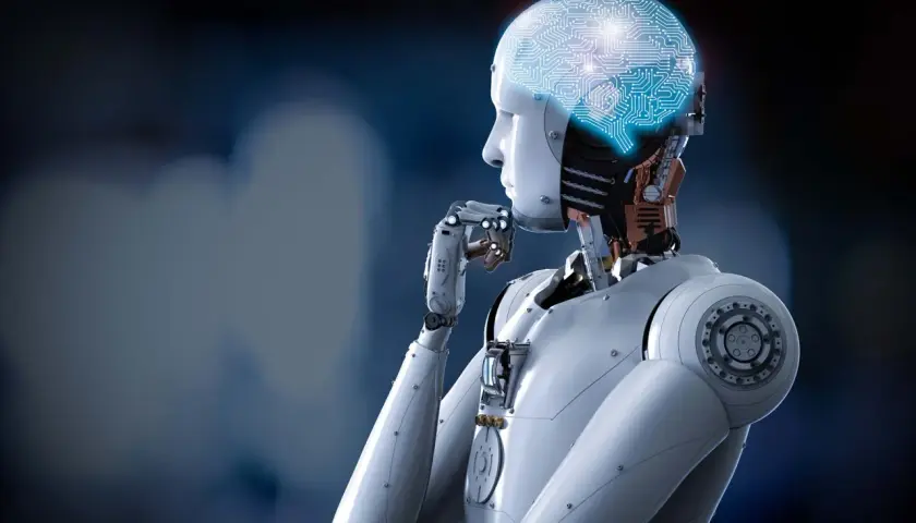 Robot z świecącym mózgiem w kształcie obwodów drukowanych, zastanawiający się nad tym, czym jest kognitywistyka.