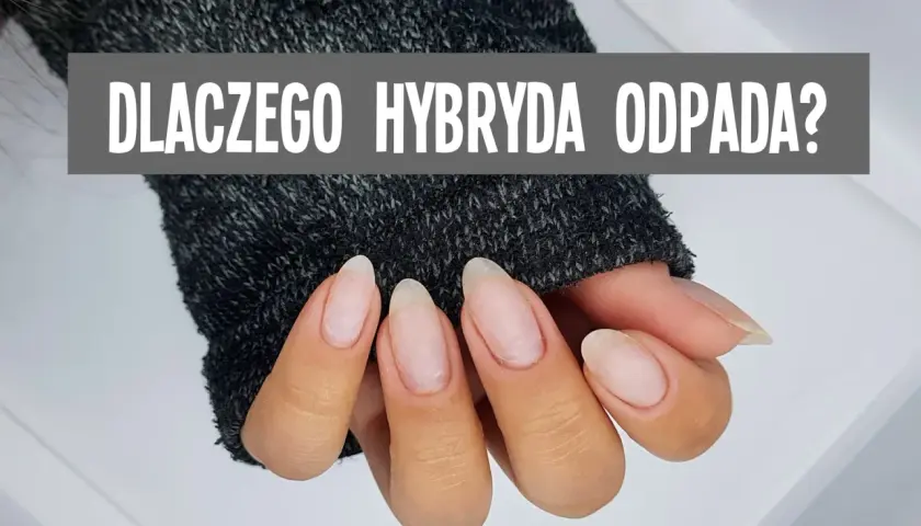 Dłonie w szarym swetrze, z widocznymi paznokciami. Napis: "DLACZEGO HYBRYDA ODPADA?". Nic mi się nie trzyma na paznokciach?