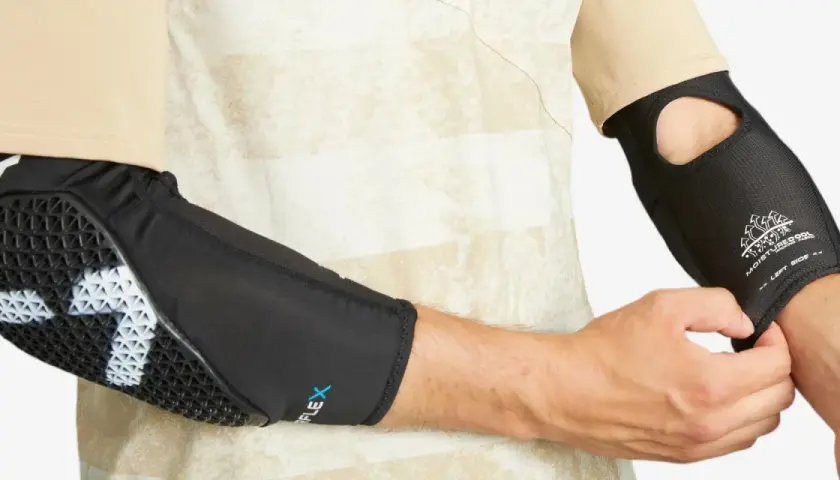 Ochraniacze na łokcie z technologią Flex i MoistureCool, idealne do rehabilitacji po łokieć tenisisty.