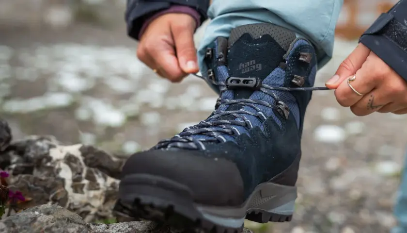 Lacing up new hiking boots. Wondering how long to break in shoes for comfort on the trail.