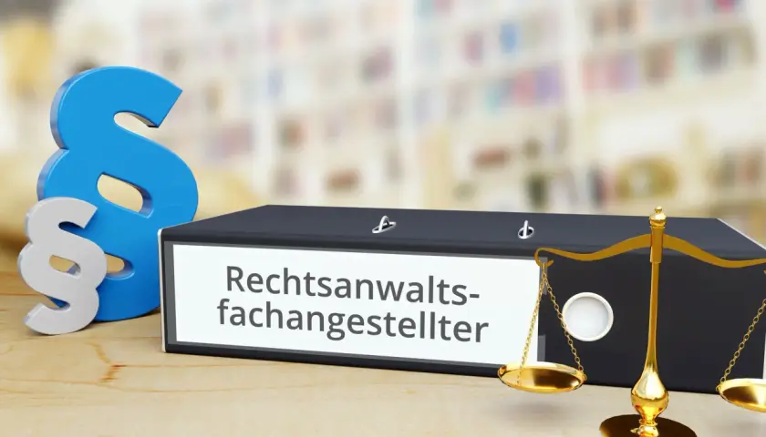 Paragraphen-Symbole, Aktenordner mit "Rechtsanwaltsfachangestellter" und eine Waage. Informationen zum Rechtsanwaltsfachangestellte Gehalt sind hier relevant.