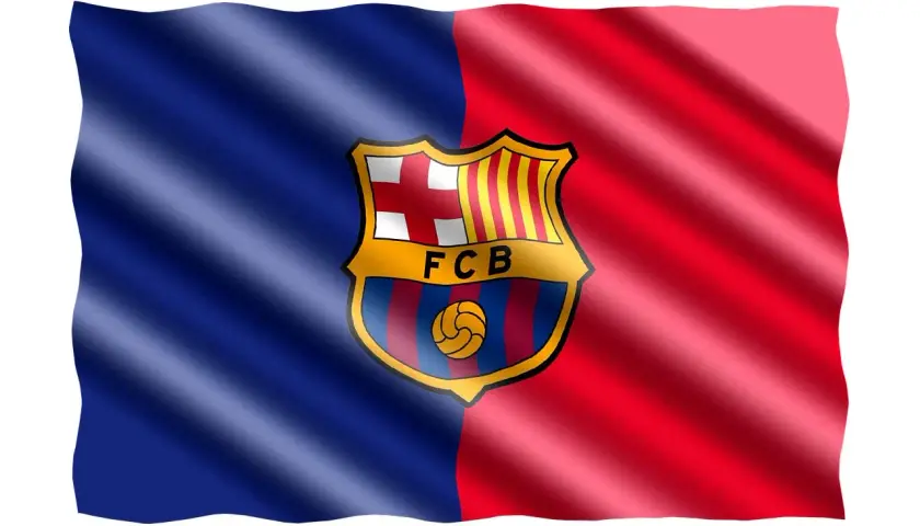 Flaga FC Barcelona, symbol dumy i historii klubów z Barcelony, faluje dumnie na wietrze.