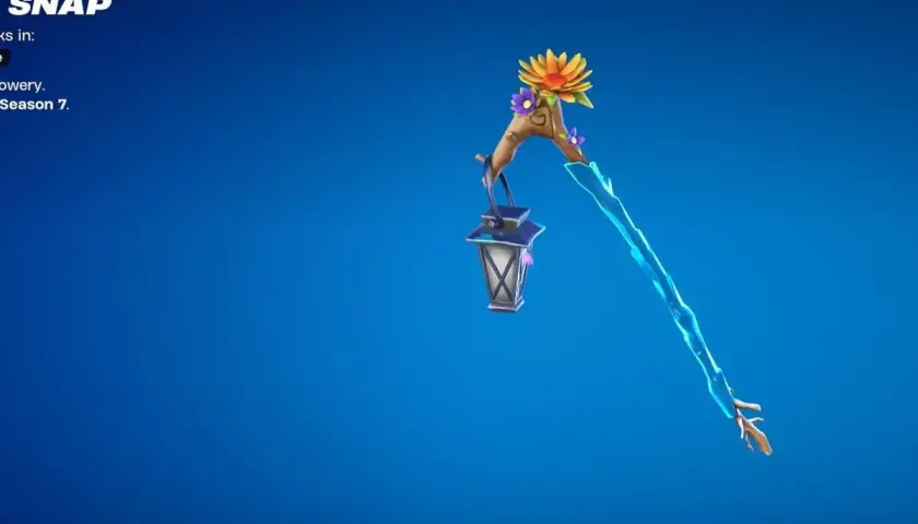 Słodziak Fortnite w postaci kilofa z latarenką i kwiatami.