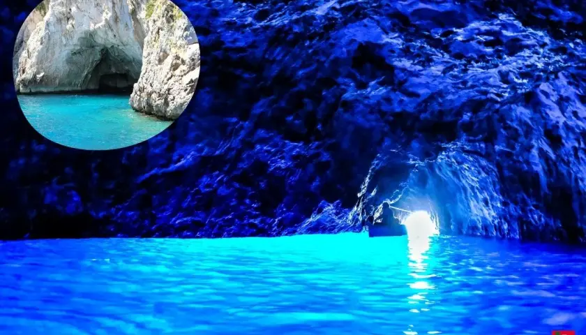 Un piccolo barca entra nella magica gruta azul, illuminata da un'intensa luce blu che riflette sull'acqua cristallina.