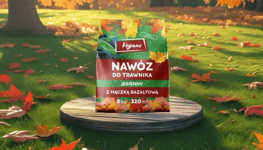 Jesienny nawóz do trawnika Vegano z mączką bazaltową, który zawiera superfosfat, na tle jesiennego ogrodu.