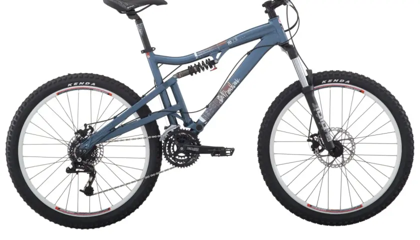 A blue Diamondback Recoil mountain bike with full suspension, Kenda tires, and disc brakes, ready for any trail.