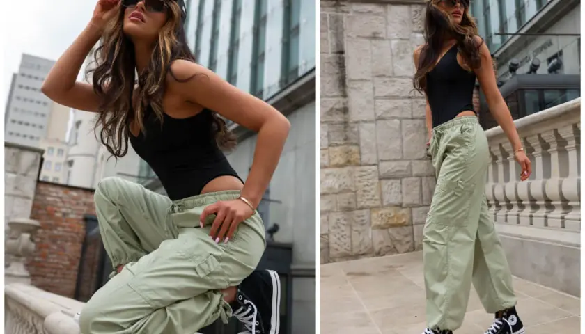 Kobieta w czarnym body i zielonych spodniach cargo, co to znaczy? To styl miejski, wygodny i modny.