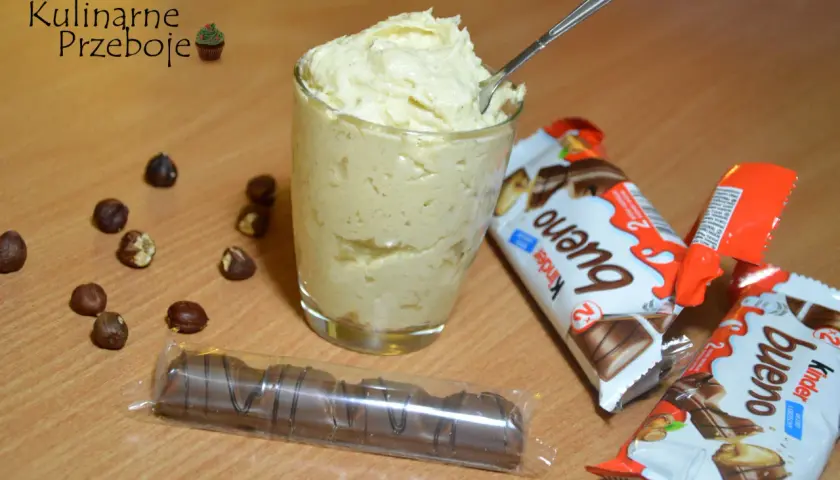Pyszny krem kinder bueno do tortu, przygotowany z orzechami i batonikami.