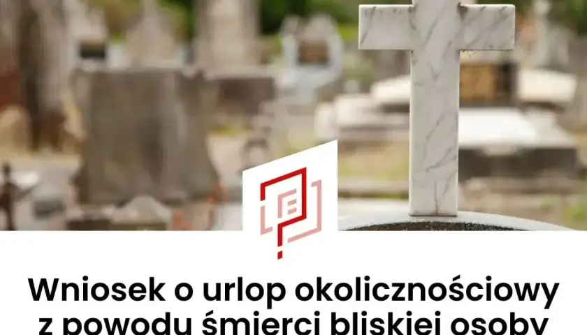 Cmentarz z krzyżem i nagrobkami. Wniosek o urlop okolicznościowy z powodu śmierci bliskiej osoby.