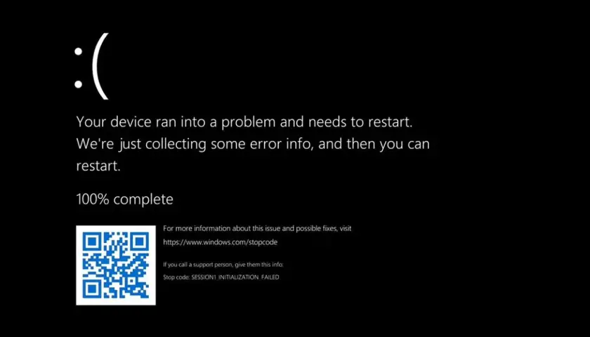Smutna buźka na ciemnym ekranie laptopa. Błąd systemu Windows: SESSION1_INITIALIZATION_FAILED.