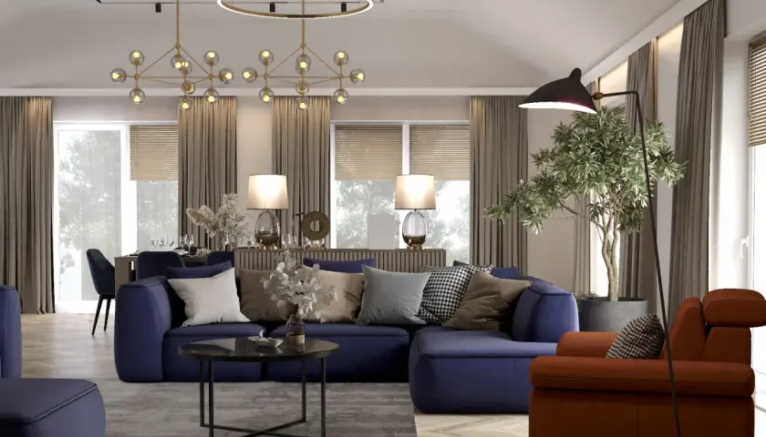 Nowoczesny salon z aneksem kuchennym 30m2 projekt: granatowa sofa, pomarańczowy fotel, designerskie lampy i jadalnia w tle.