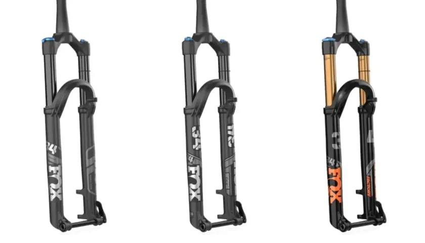 Three Fox suspension forks: two black Performance models and one black Factory model with gold stanchions, showcasing the difference between Fox Factory vs Performance.