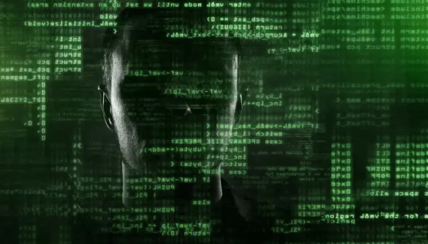 Twarz hakera w zielonym kodzie. Czy to jest tour po świecie cyberprzestępczości?