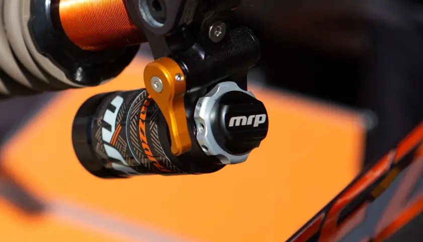 Close-up of a bicycle shock absorber with an "mrp" logo, part of a mrp hazzard review.
