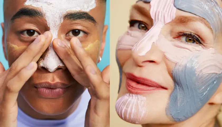 Två ansikten med ansiktsmasker. En ung person applicerar mask på näsan, medan en äldre person har en färgglad mask som konstverk. Ett sant essence ansikte.