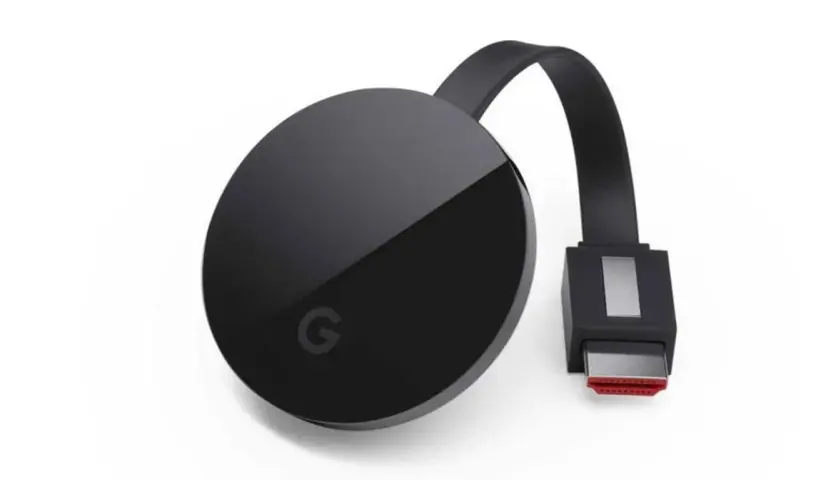 Czarny Chromecast z logo Google. Dowiedz się, jak połączyć się z chromecast, aby strumieniować treści.