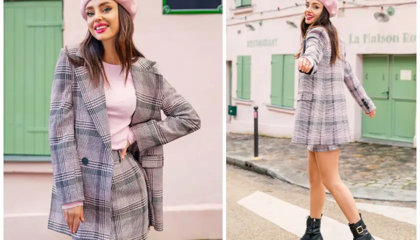 Dziewczyna w różowym beretce i kraciastej marynarce z mini spódniczką, prezentująca styl preppy.