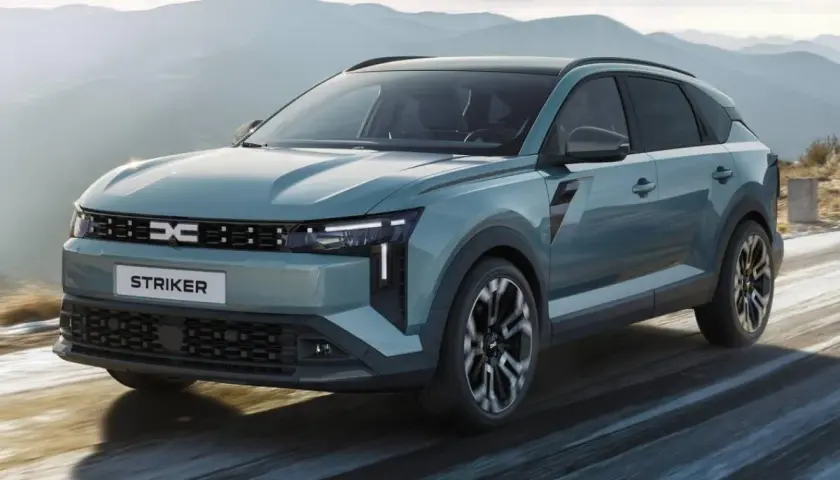 Dacia c neo, un SUV moderno, attraversa un paesaggio montano innevato.