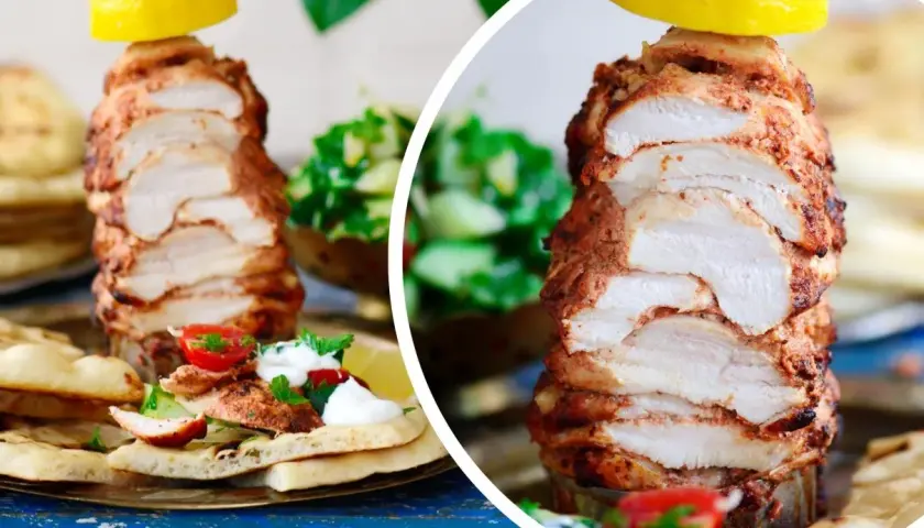Soczysty kurczak döner na talerzu z pitą, pomidorkami i sałatką. Cytryna na wierzchu dodaje świeżości.