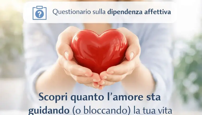 Mani che sorreggono un cuore rosso, simbolo di amore. Un invito a scoprire se si tende a pensare di non meritare amore, esplorando la dipendenza affettiva.
