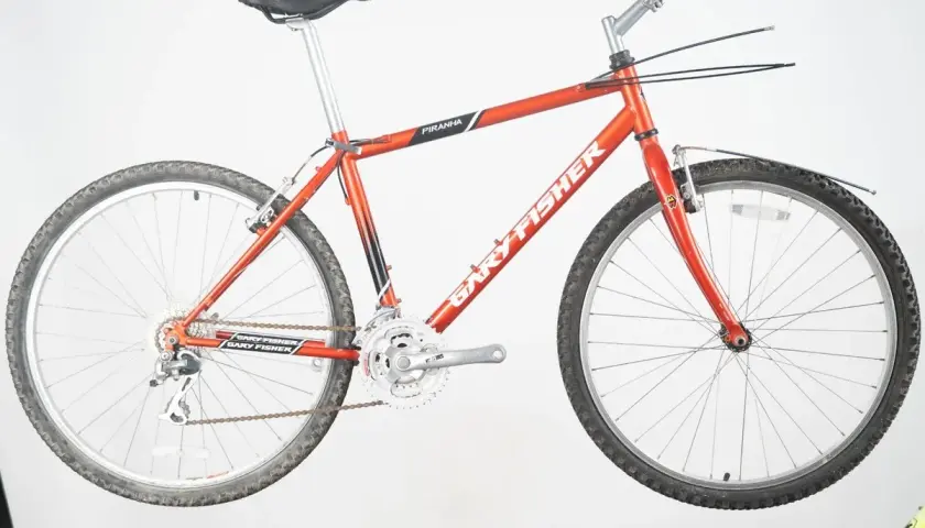 A vintage red Gary Fisher Piranha mountain bike, ready for adventure.