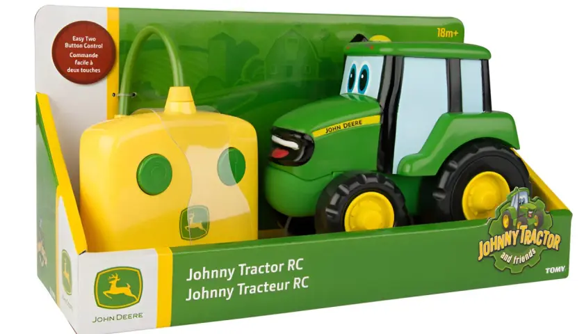 Zabawkowy traktor zdalnie sterowany Johnny Tractor RC, zielony, z żółtym pilotem. Idealny dla małych fanów maszyn rolniczych John Deere.