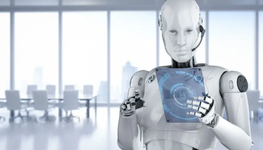 Robot z interfejsem dotykowym w nowoczesnym biurze. Czy sztuczna inteligencja to szansa czy zagrożenie dla przyszłości?