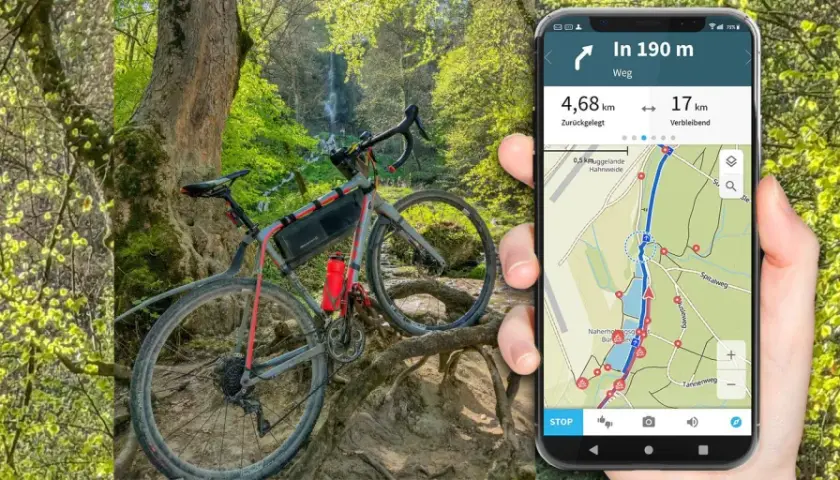 Rower gravelowy przy wodospadzie, a obok smartfon z aplikacją komoot pokazującą trasę i dystans.