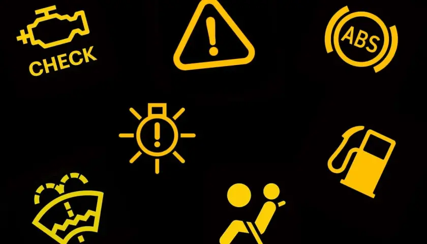 Żółta kontrolka "CHECK ENGINE" i inne ostrzeżenia w aucie: ABS, poduszka powietrzna, paliwo, światła, wycieraczki.
