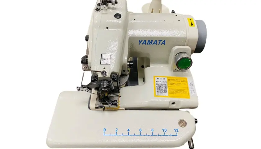 A Yamata sewing machine with a blind stitch foot attachment, ready to demonstrate how to use a blind stitch foot for invisible hems.