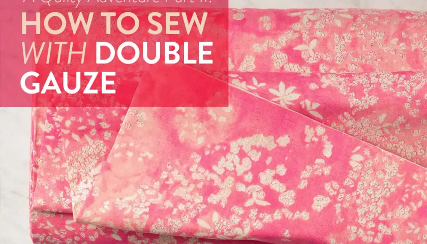 A pink floral double gaze de coton fabric is folded, with text overlaying the image.