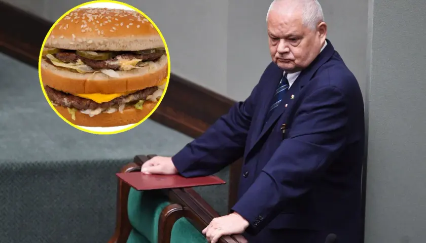 Polityk w garniturze pochyla się nad mównicą, obok widoczny Big Mac. Czy to symbol jego myśli o big mac cena?