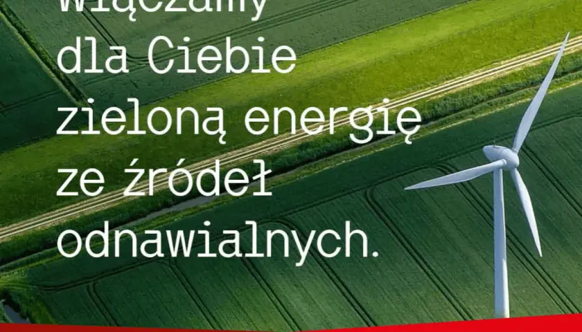 Wiatrak na tle zielonych pól. Napis: "Włączamy dla Ciebie zieloną energię ze źródeł odnawialnych." Co oznacza skrót OZE? To właśnie energia odnawialna.